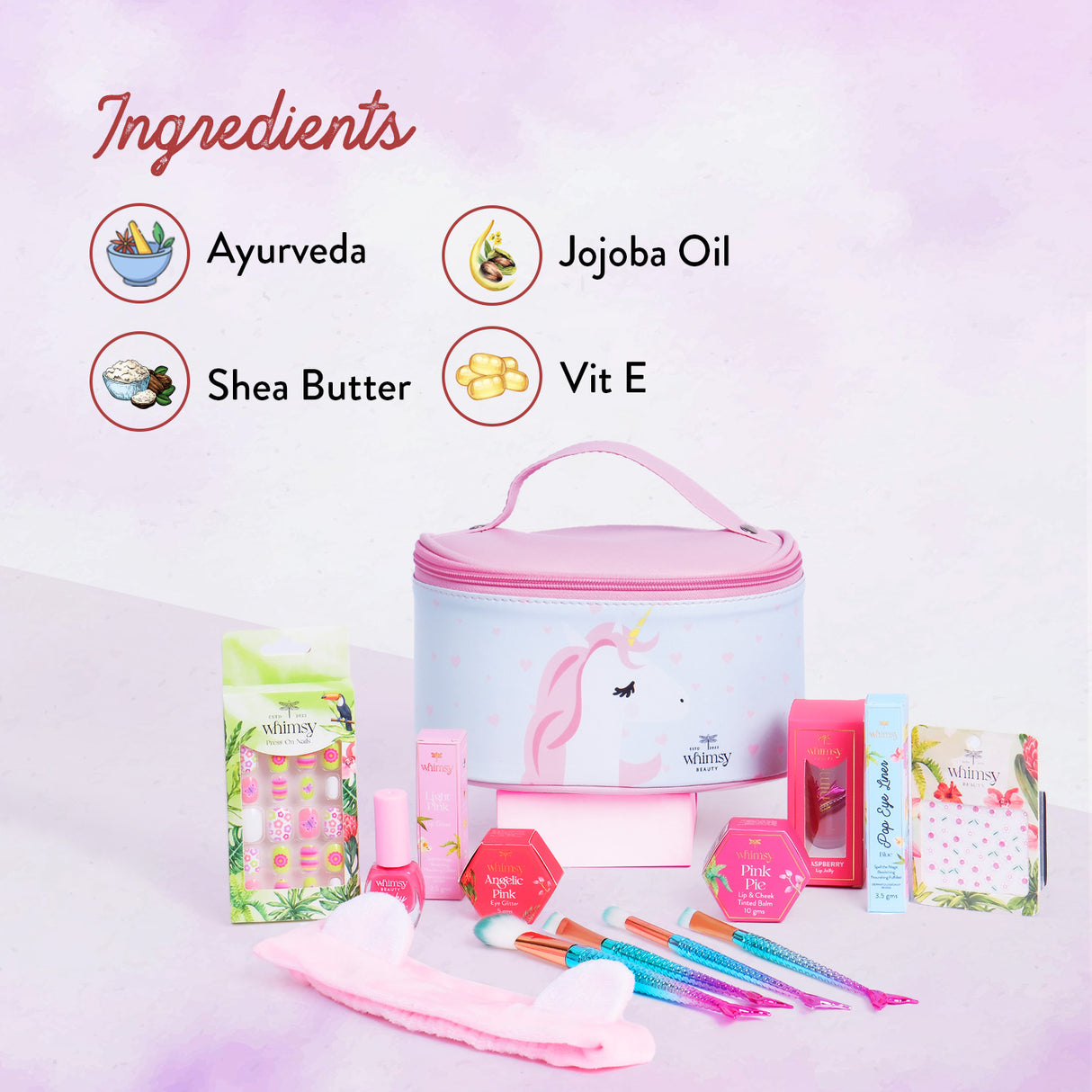 Cosmetic set with unicorn design on a light pink background, featuring ingredients like Ayurveda, Jojoba Oil, Shea Butter, and Vit E.