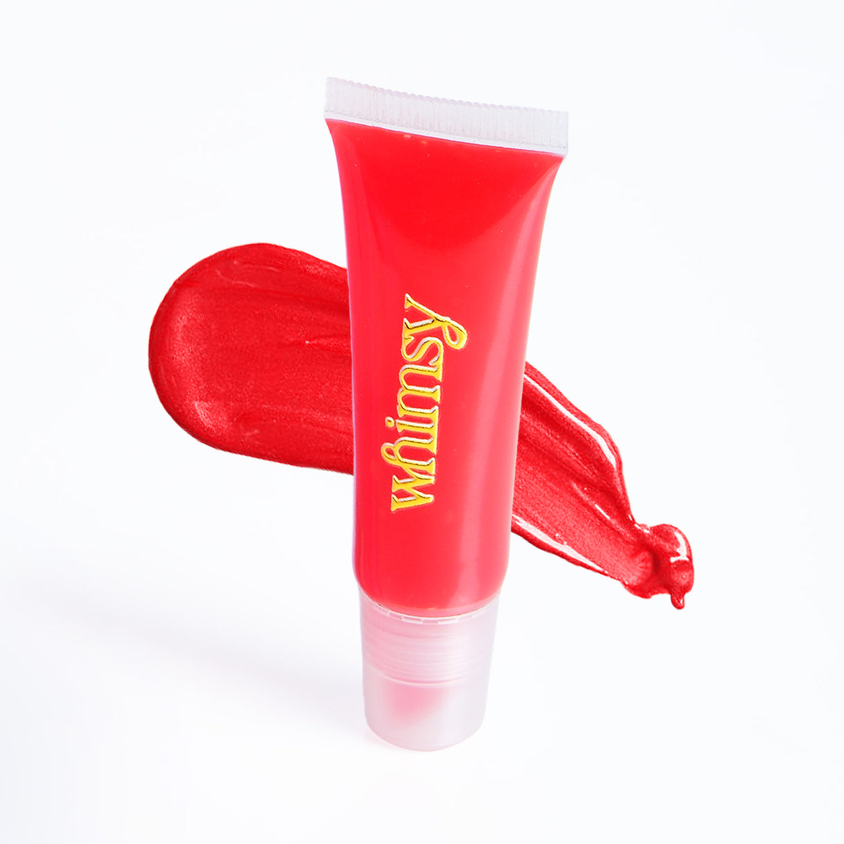 Red lip balm tube with 'whimsy' text on a white background