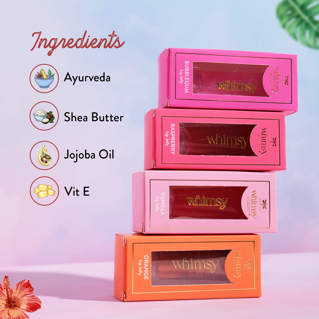 Stack of pink and orange boxes with 'Whimsy' branding, featuring ingredients like Ayurveda, Shea Butter, Jojoba Oil, and Vit E on a colorful background.