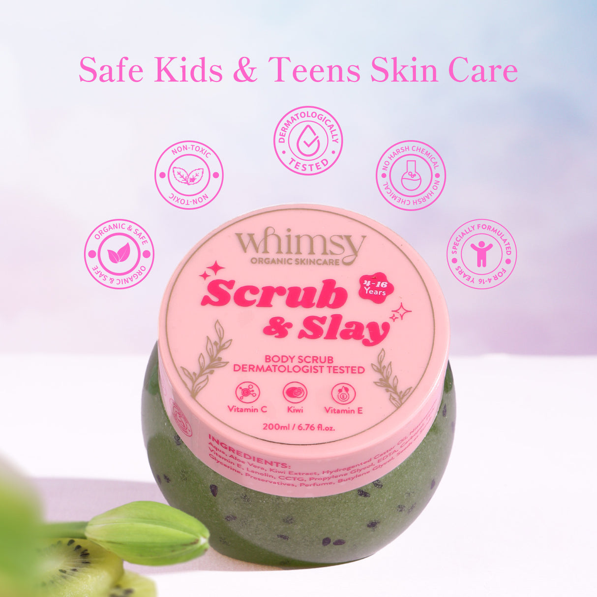 Green body scrub jar with pink label titled 'Scrub & Slay' by Whimsy on a light purple background.
