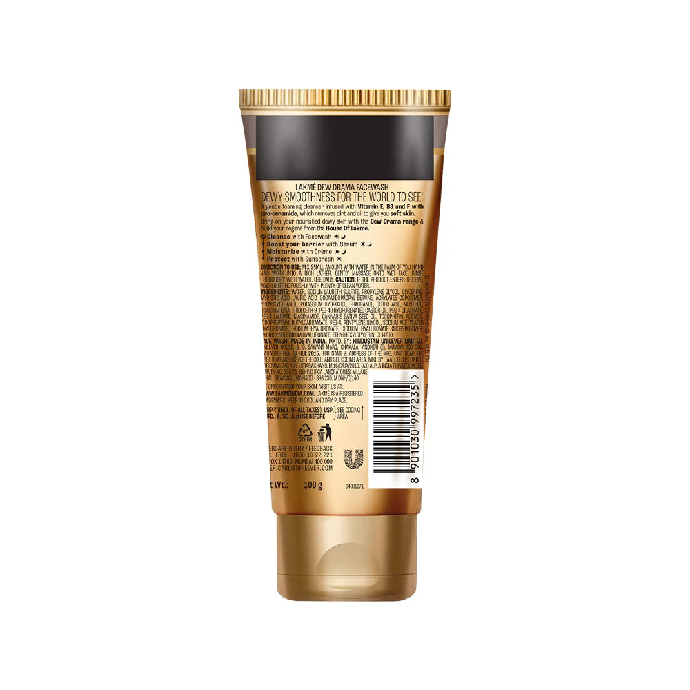 Gold tube of cosmetic product with label on a white background