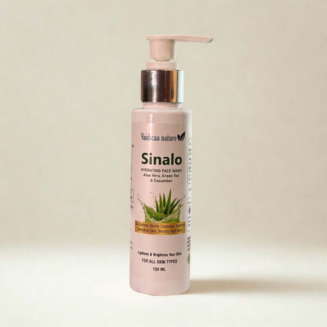 Pink bottle of Sinalo face wash with aloe vera on a beige background