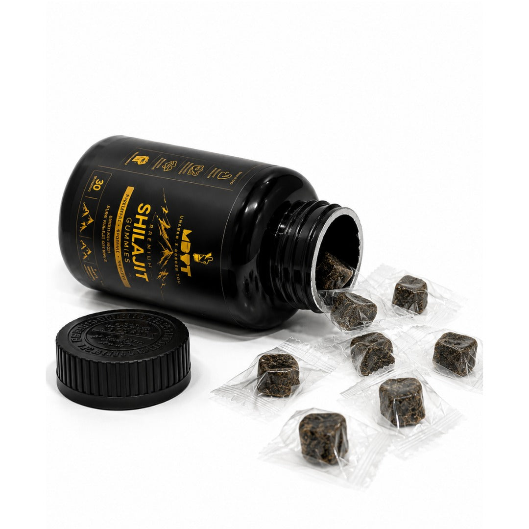 Black bottle of Shilajit with loose pieces and packaging on a white background