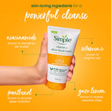 Hand holding a tube of Simple vitamin C glow facial wash