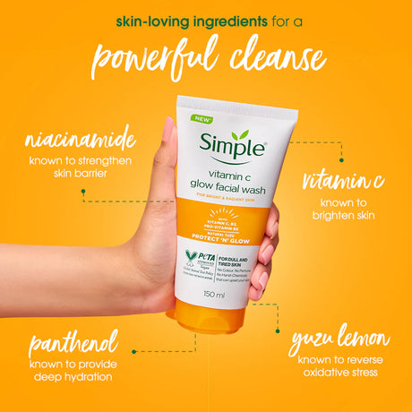 Hand holding a tube of Simple vitamin C glow facial wash