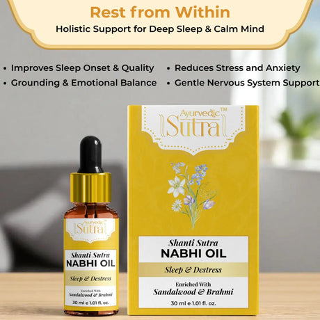 Shanti Sutra Nabhi Oil bottle and packaging on a wooden surface with a blurred background