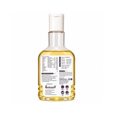 Bottle of oil with a label on a white background