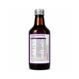 Bottle of Ayurvedic medicine with a purple label on a white background