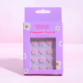 Packaging of Whimsy pimple patches with pink flowers on a light purple background