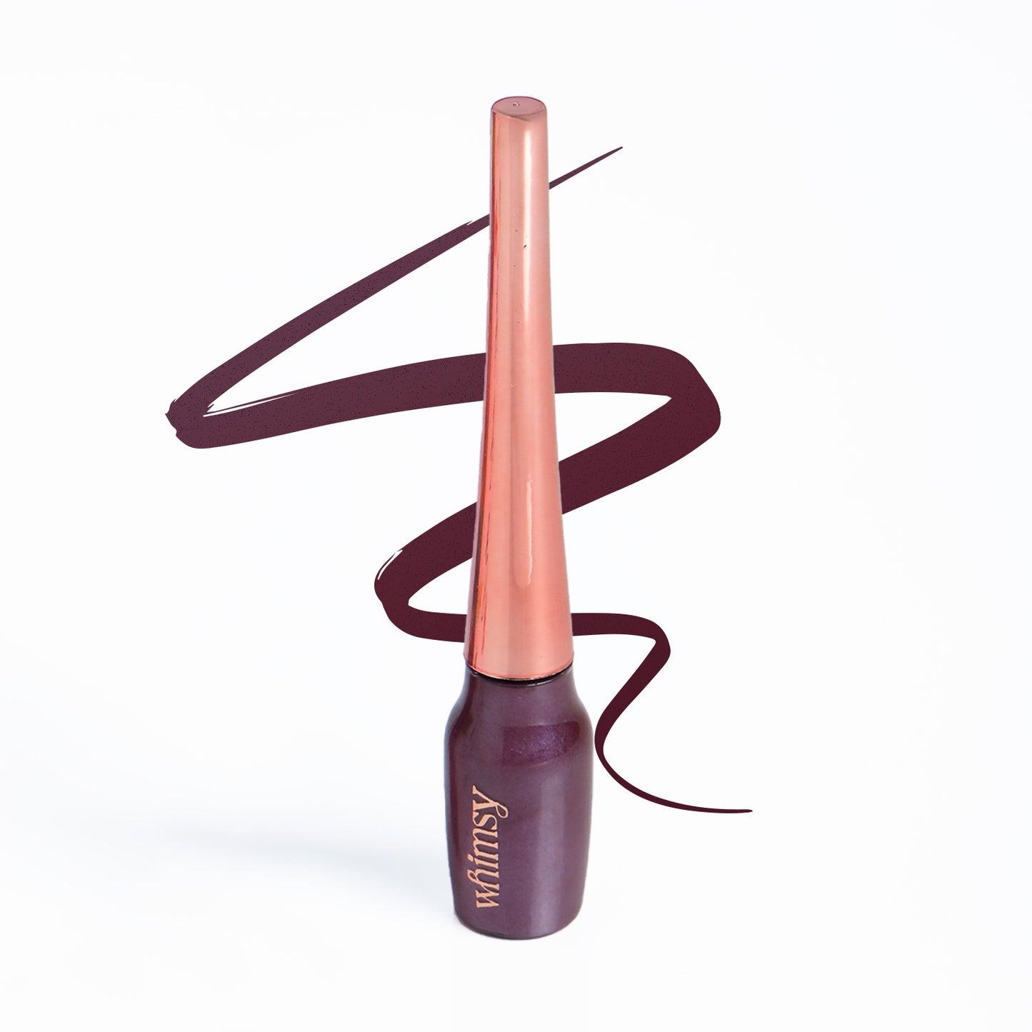 Lipstick with rose gold cap and dark purple body on a white background