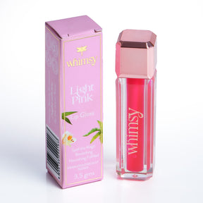 Pink lip gloss with packaging labeled 'whimsy' on a white background