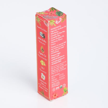 Pink box with tropical designs and text on a white background