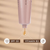 Cosmetic bottle with a droplet labeled 'SPF 30' and 'Vitamin B3'