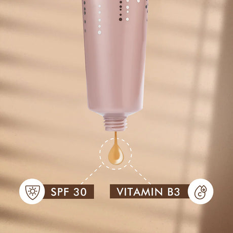 Cosmetic bottle with a droplet labeled 'SPF 30' and 'Vitamin B3'
