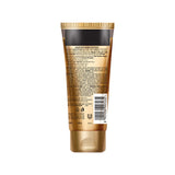 Gold tube of cosmetic product with label on a white background