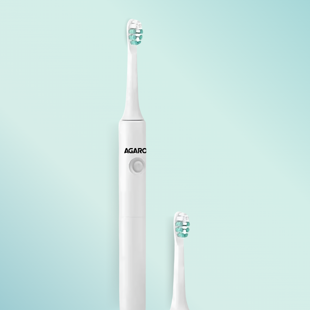 White electric toothbrush with Agaro branding on a light blue background