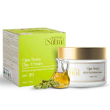 Ojas Sutra Day Cream with packaging and oil on a white background