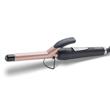 Rose gold and black hair straightener on a white background