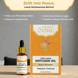 Nidra Sutra diffuser oil bottle and packaging on a wooden surface with a gray background.