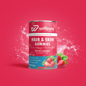 Wellpure Nutrition Hair & Skin Gummies can with strawberries on a red background