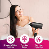 Woman using a hair dryer with product features highlighted on a pink background