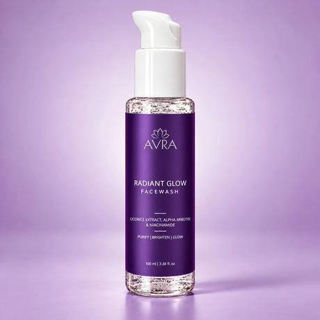 A bottle of AVRA Radiant Glow Facewash with a white pump dispenser and a purple label, set against a solid lavender background.