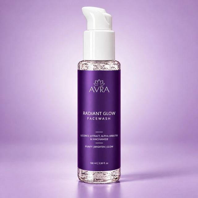 A bottle of AVRA Radiant Glow Facewash with a white pump dispenser and a purple label, set against a solid lavender background.