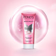 Pond's Bright Beauty face wash tube on a pink background