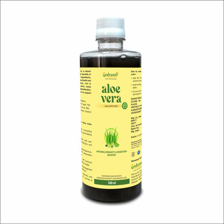 Bottle of aloe vera juice with a yellow label on a white background