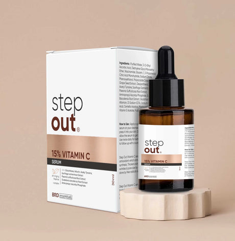 Step Out 15% Vitamin C serum bottle and packaging on a beige background