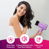 Woman holding a purple hair dryer with features highlighted on a white background