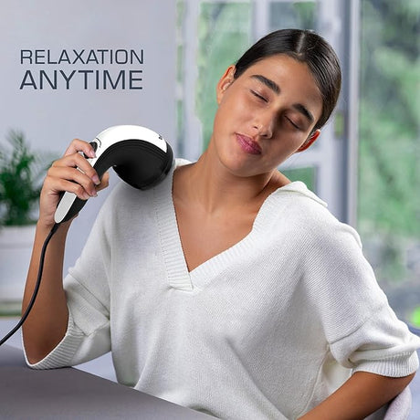 Woman using a handheld massager