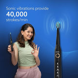Woman holding an Agaro electric toothbrush with text about sonic vibrations on a blue background