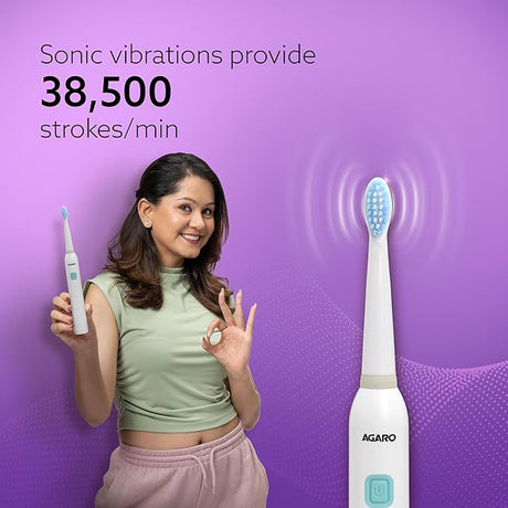 Woman holding an electric toothbrush