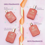 Four perfume bottles from 'The Whimsy' brand on a pink background with product names and scents.