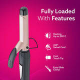 Hair styling tool with features listed on a pink background