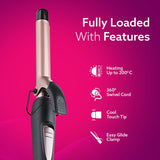 Hair curler with features listed on a pink background