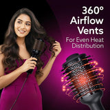 Woman using a hair dryer with 360° Airflow Vents on a purple background